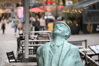 Statue of a man watching in the sky